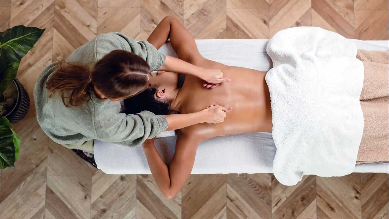 Message Therapy Woman gets a deep healing massage